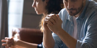 Man and woman wondering how to resolve conflict in a relationship