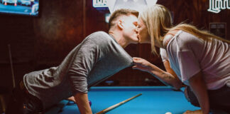 couple kissing on pool table following hookup rules